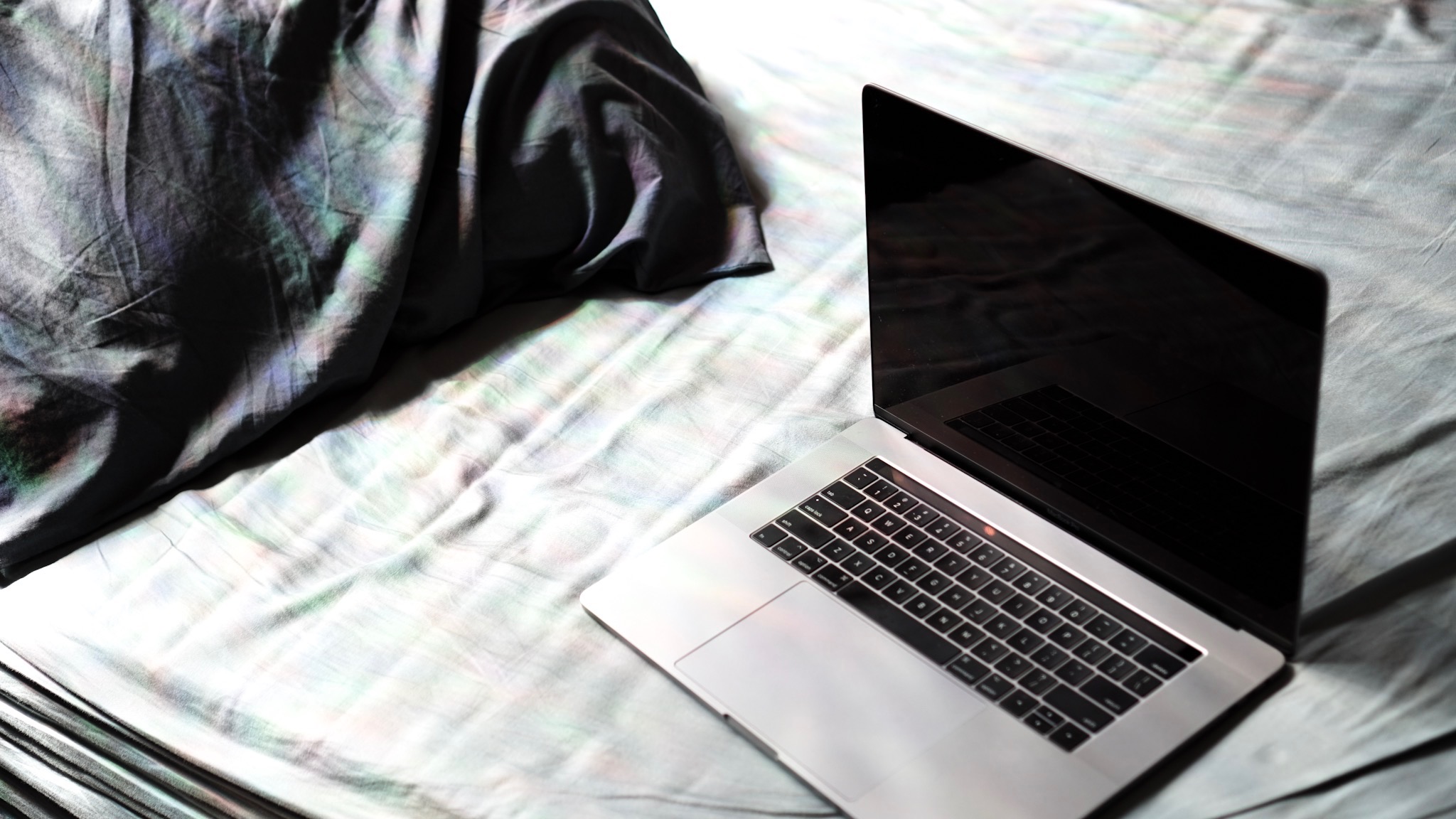 Macbook on a bed